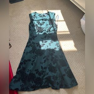 Green and black patterned dress